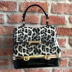 Leopard print patient leather hidden compartment bag